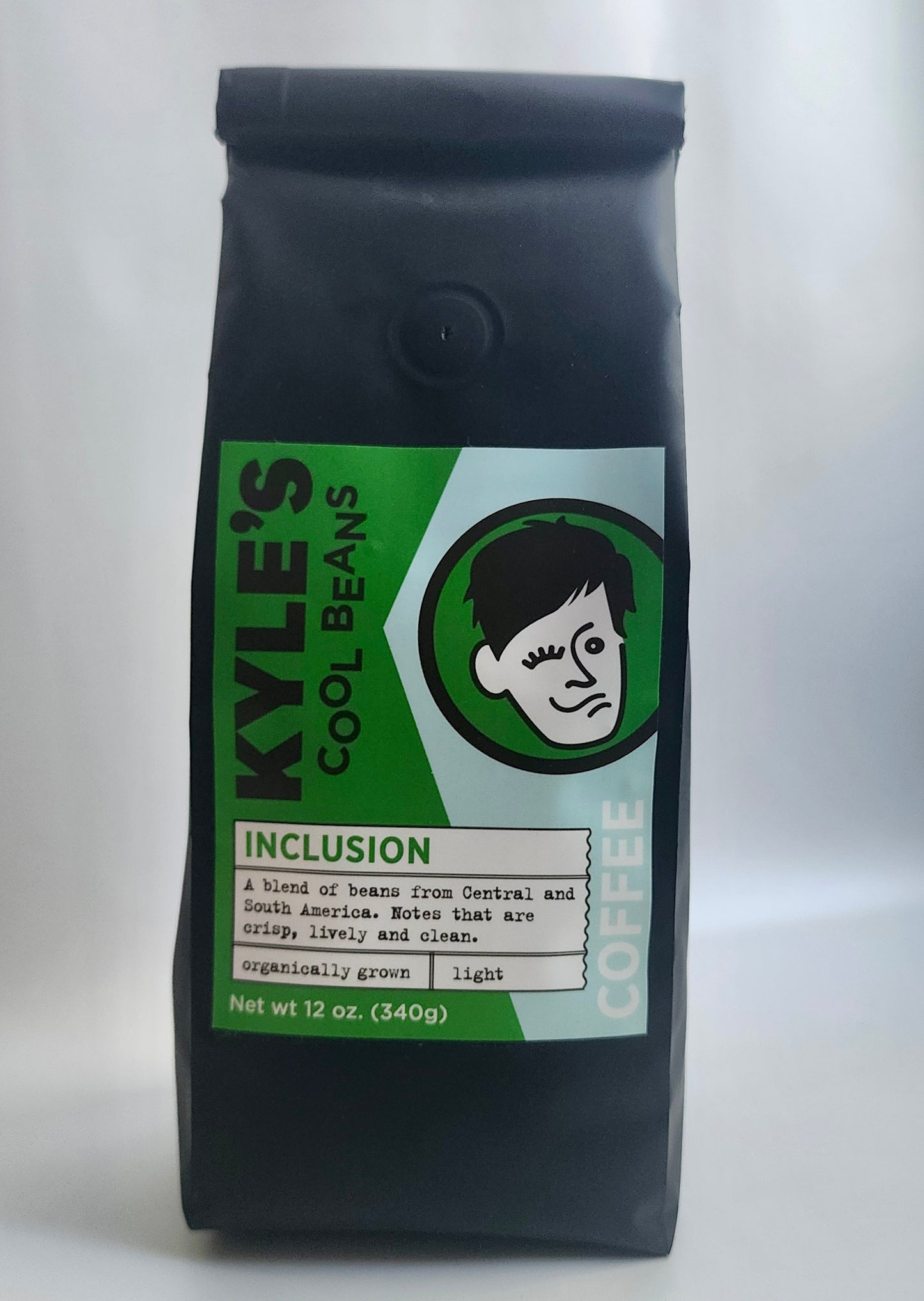 A picture of the front of an Inclusion coffee bag. The bag is smooth and the label is on the front of the bag, it is made of paper.