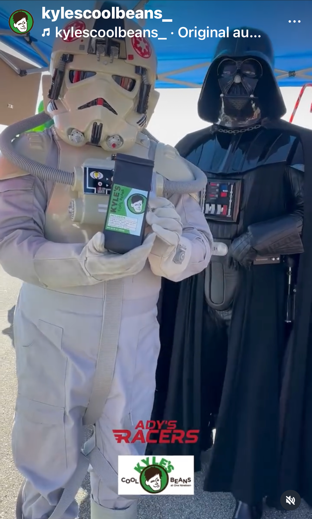 Two people in costume, one resembling a Storm Trooper and the other resembling Darth Vader, holding a Kyles Cool Beans Bag