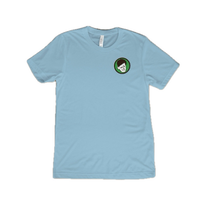 Blue KCB T-Shirt Front, light blue shirt, Kyle’s face logo on the left 