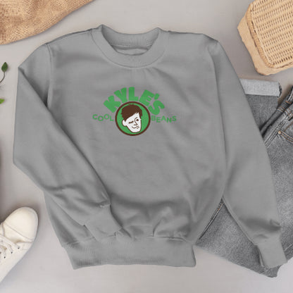 Gray sweatshirt with Kyle’s Cool Beans logo on a light gray surface