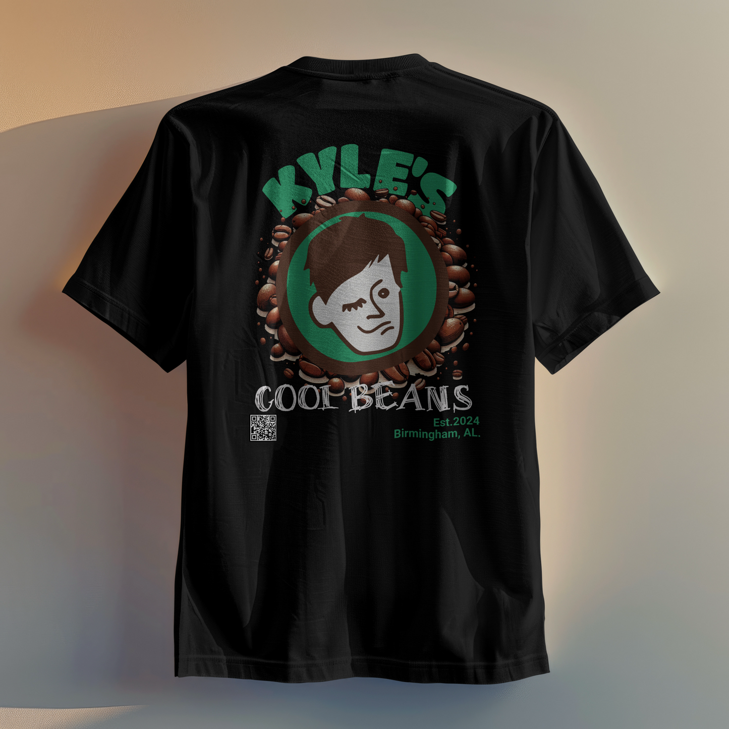 Kyle’s T-Shirt, Kyle’s logo on top of a background of coffee beans, with a QR code that links the shirt to this website